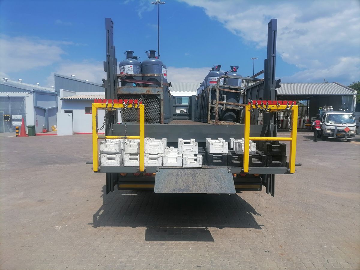 Load testing a truck tail lift with test weights