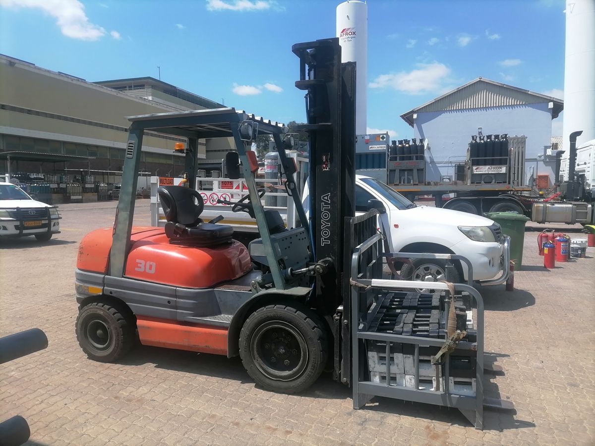 Forklift load test with test weights in a cage
